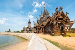 the sanctuary of truth in pattaya, thailand,a gigantic wooden carve sculpture construction