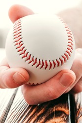 Baseball in hand - souvenir from the stadium - fan caught the ball
