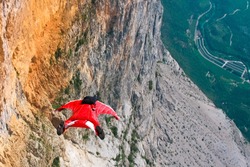 Wingsuit B.A.S.E. jumper jumps off a cliff in Italy