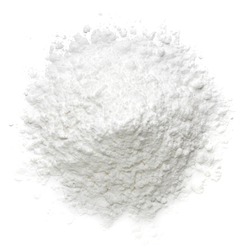 Icing, caster, confectioners or powdered sugar pile from top view isolated on white background