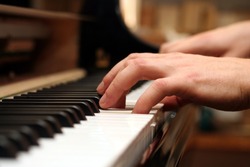 the hands of a piano playing guy in a sensitive mood.