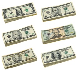 Stacks of US dollar bills in isolated white background