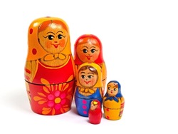 Matryoshka, hand-painted wooden dolls against a white background