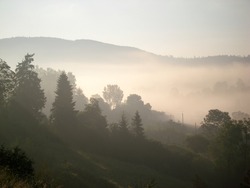 View of misty fog mountains in autumn, Carpathians, Ukraine
