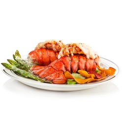 Grilled Lobster Tails Served With Asparagus on white background