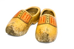 Old and dirty wooden shoes, traditional dutch footwear