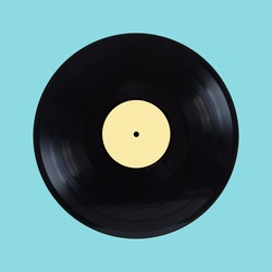 Black oldschool long-play vinyl record with yellow label isolated on cyan background front view closeup