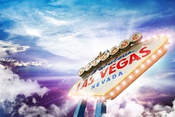 Welcome in Las Vegas - Illuminated Vegas Sign on Colorful Cloudy Sky.