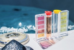 Closeup of Water Quality Manual Test Kit with Color Scale for PH and Chlorine Level. Residential Swimming Pool Care, Treatment and Testing Routine.