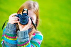 Teenager Girl Learn How to Take Pictures Using DSLR Camera. 