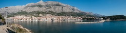 City of Makarska and calm blue sea panorama on sunny summer day