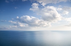 Blue sky with clouds over sea. Nature composition.