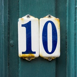 House number ten on two separate enameled plates.