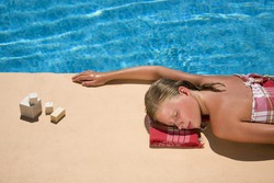 young woman at the swimming pool in a spa resort