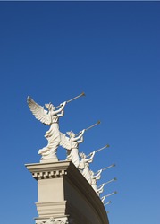 Perspective of winged trumpeters with golden trumpets