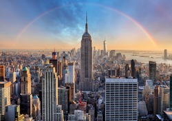 New York City skyline with urban skyscrapers and rainbow.