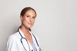 Medical physician doctor woman over white background, closeup portrait