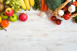 Variety of fruits and vegetables, on the white wooden table, top view, copy space, selective focus