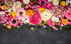 Various flowers on black background. Overhead view with copy space