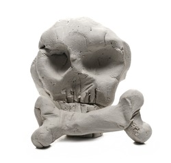 Grey modelling clay shaped in skull sculpture isolated on white background