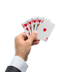 A royal flush in hearts in hand isolated on white background