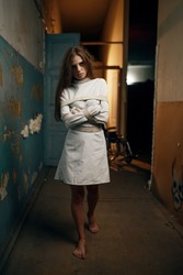 Female patient in straitjacket, mental hospital