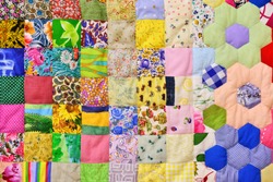 Patchwork quilt. Part of patchwork quilt as background. Flower print. Color blanket in style patchwork. Color blanket. Handmade.