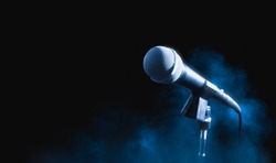microphone on a dark background with smoke