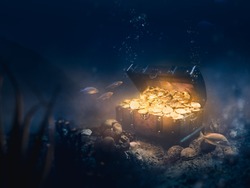Open treasure chest sunken at the bottom of the sea / high contrast image