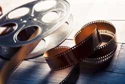 Movie reel on a wooden background