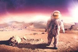 Astronaut walking on an unexplored planet 