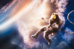 Astronaut floating in the stratosphere near a planet
