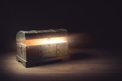 Pandora's box with smoke on a wooden background
