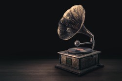 vintage gramophone on a wooden background with dramatic lighting
