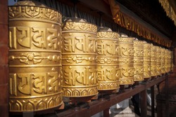 Prayer wheels made from metal at Swayambhunath Temple, Kathmandu, Nepal
