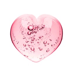 Pink serum gel, heart shape puddle isolated on white backdrop, top view. Squeezed transparent care gel with bubbles close up, macro isolated on white background.