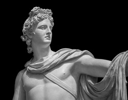 God Apollo bust sculpture. Ancient Greek god of Sun and Poetry Plaster copy of a marble statue isolated on black