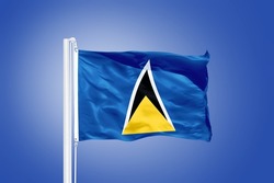 Flag of Saint Lucia flying against a blue sky.
