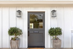 Dark gray front door of classic style home.