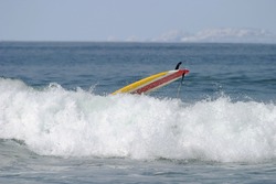 Yellow Surfboard Wipeout