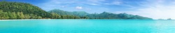 Beautiful tropical Thailand island panoramic with beach, white sea and coconut palms for holiday vacation background concept