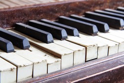 Keys from an old broken and damaged piano