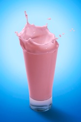 Splash of Pouring Strawberry Milkshake in A Glass