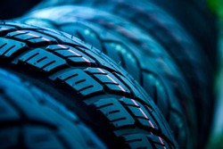 Group of  new tires for sale at a tire store. selective focus.