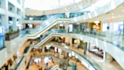 Defocused blur of people on shopping mall.