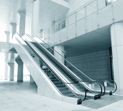 Two escalators in new modern building.