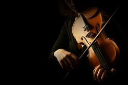 Violin player. Violinist hands playing violin orchestra musical instrument closeup
