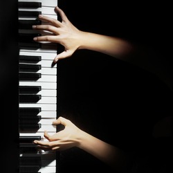 Piano music pianist hands playing. Musical instrument grand piano details with performer hand on black background