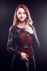 Woman with violin player violinist Classical musician portrait with music instrument