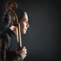Inspired woman profile cello. Beautiful cellist classical musician with musical instrument